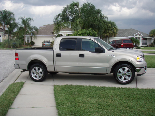 Silver 2006 Ford F-150 pickup truck, side view