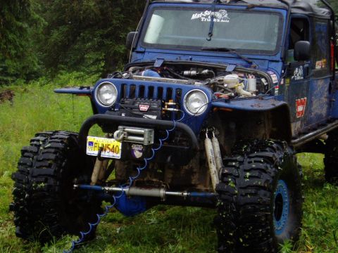 2000 Ford E350 - This modified Jeep is equipped for extreme off-road conditions with large tires and a winch.