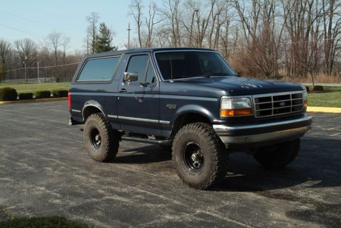 1992 Ford Bronco - This 1992 Ford Bronco is shown from the front-three-quarter view, lifted with off-road tires.