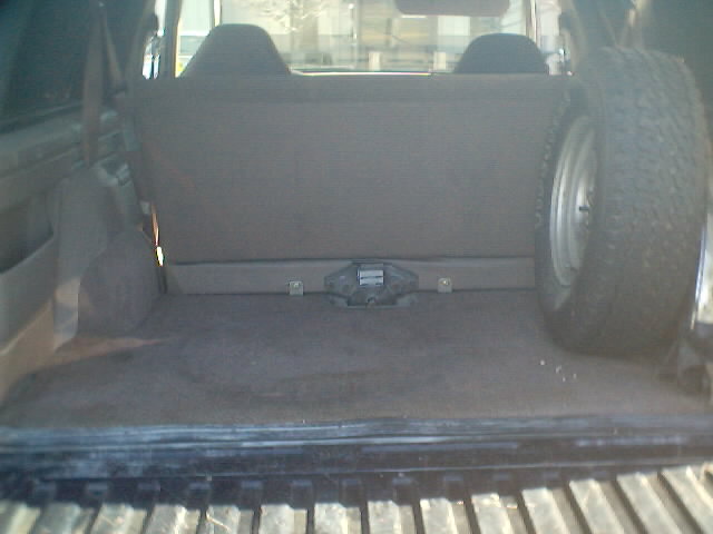 1992 Ford Bronco interior cargo area, spare tire visible on right