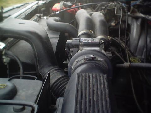 1992 Ford Bronco - Close-up view of the engine bay, focusing on the air intake system and associated components.