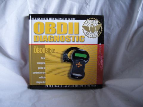 2007 Ford Mustang - Photo of the book cover 'OBDII Diagnostic / The OBDII Bible' by Peter David showing a code reader.