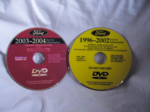 2007 Ford Mustang - Product photo of two Ford service-information DVD discs lying on a sheet, not a technical document.