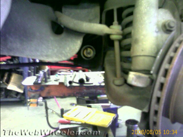 Car suspension parts including a coil spring, shock absorber, and sway bar link