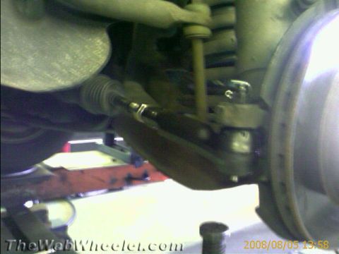 1985 Ford Mustang - Close-up view of a vehicle's suspension system, focusing on the tie rod end and ball joint.