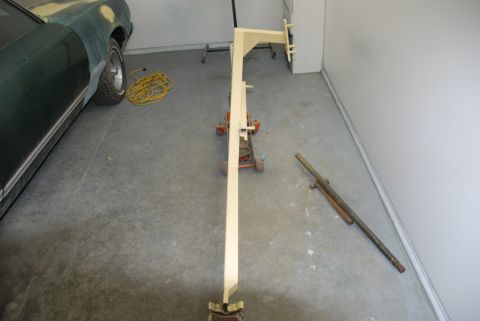 1996 Ford Bronco - Photograph of a fabricated engine-hoist boom and floor jack in a garage, not a document.