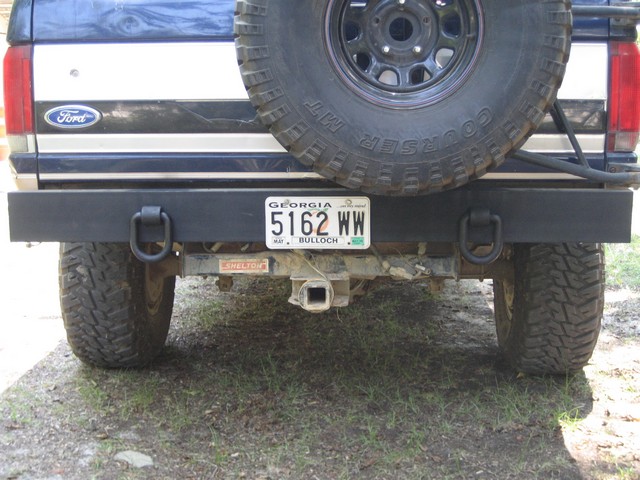 Rear view of a Ford Bronco with a spare tire mounted and a custom bumper. Georgia license plate reads 5162 WW