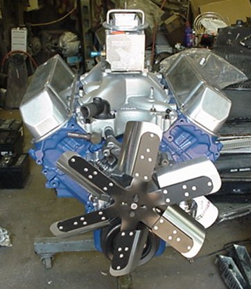 1979 Ford Bronco - V8 engine assembly with chrome valve covers and a large fan, likely for a project vehicle.