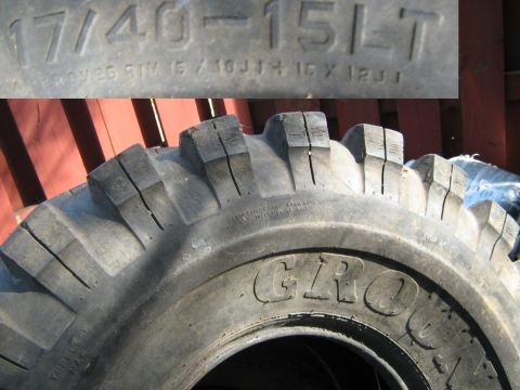 1990 Ford Bronco - Close-up of a tire showing size markings and rim specifications.