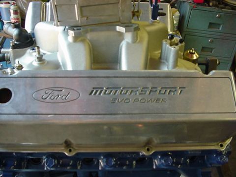 1979 Ford Bronco - Close-up of a Ford Motorsport SVO Power valve cover, part of an engine assembly.