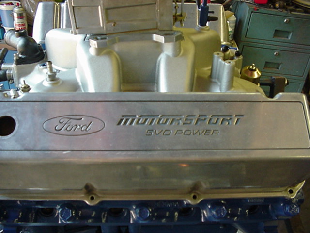 Aluminum Ford Motorsport SVO Power valve cover on a blue engine block