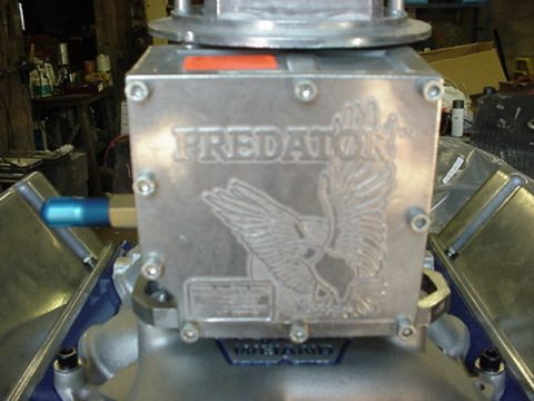 1979 Ford Bronco - Close-up of a Predator EFI system, an eagle emblem and visible text.