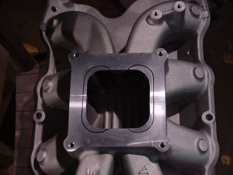 1979 Ford Bronco - Intake manifold part shown in detail, with a metal plate attached to the top opening.