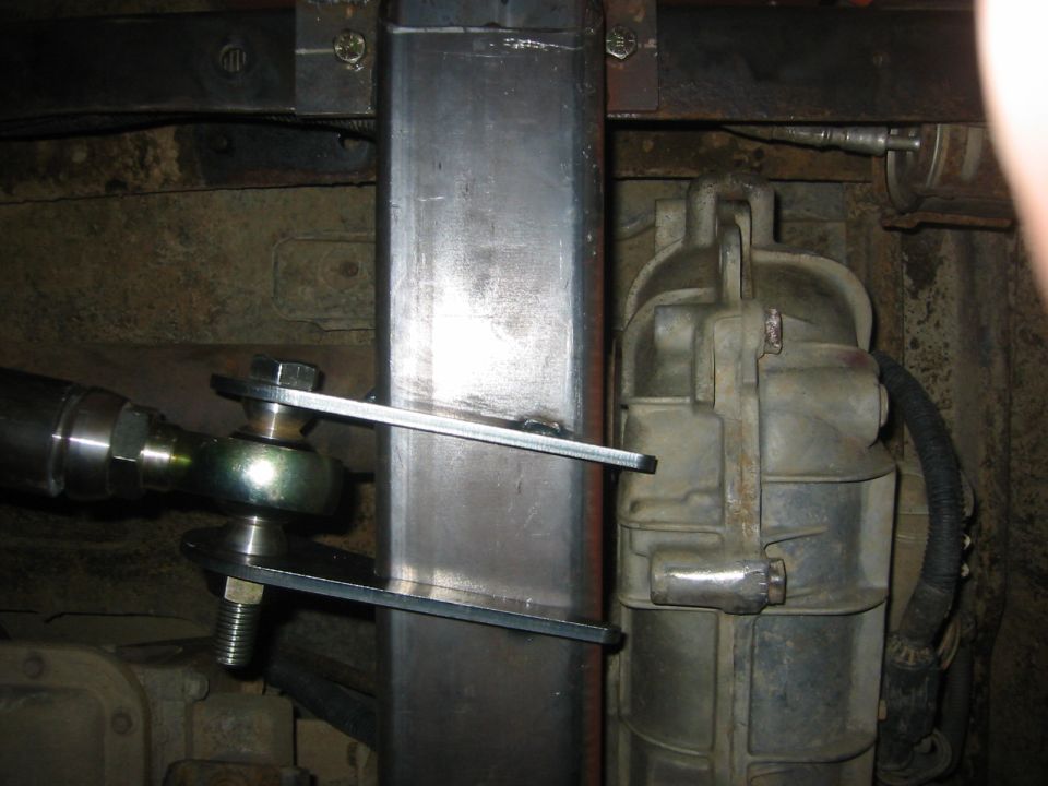 Custom suspension linkage attached to a transfer case