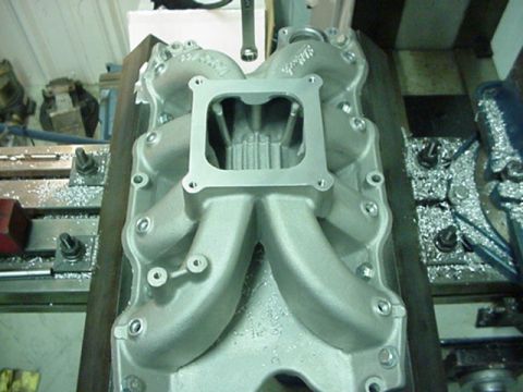 1979 Ford Bronco - Close-up of an aluminum intake manifold, likely for a performance engine build.