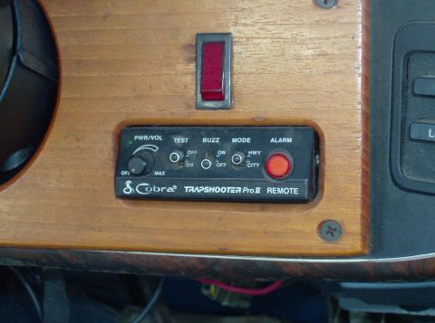 1989 Ford Bronco - Close-up of a Cobra Trapshooter Pro II Remote control panel, various buttons and a red alarm light.