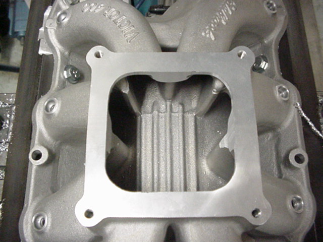 Aluminum intake manifold with a square flange and internal runners