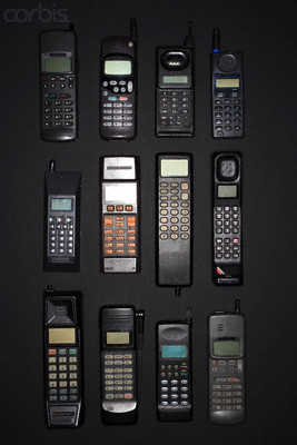 1998 Ford Crown Victoria - A display of various mobile phones, the evolution of telecommunication devices over time.