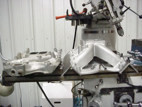 1979 Ford Bronco - Intake manifolds being machined on a milling machine in a workshop.