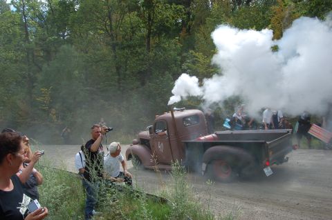 1978 Ford Bronco - A vintage pickup truck is seen emitting a large cloud of smoke.