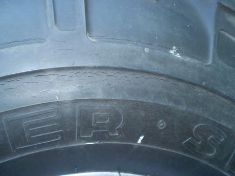 1979 Ford Bronco - This image shows a close-up of a tire, revealing significant cracking on its sidewall.