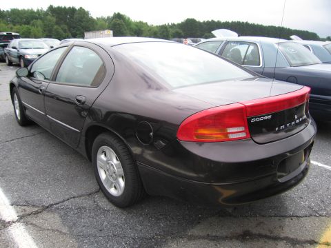 2001 Ford Crown Victoria - Dark Dodge Intrepid sedan seen from the rear in an outdoor parking lot.