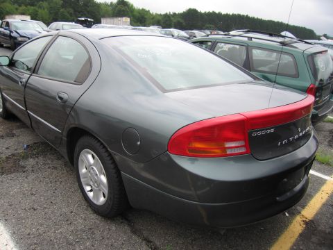 2001 Ford Crown Victoria - A dark gray Dodge Intrepid is parked in a lot with other vehicles visible.