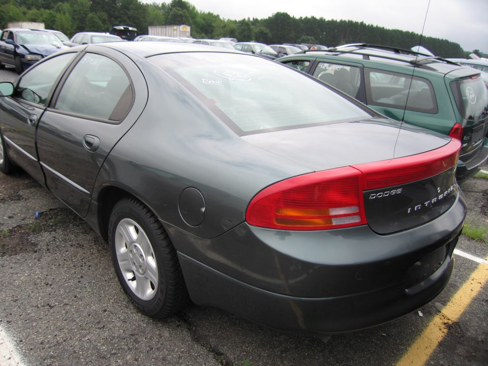 Rear quarter view of a dark gray Dodge Intrepid parked in a lot