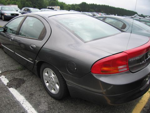2001 Ford Crown Victoria - Rear view of a dark gray Dodge Intrepid sedan parked in a lot.