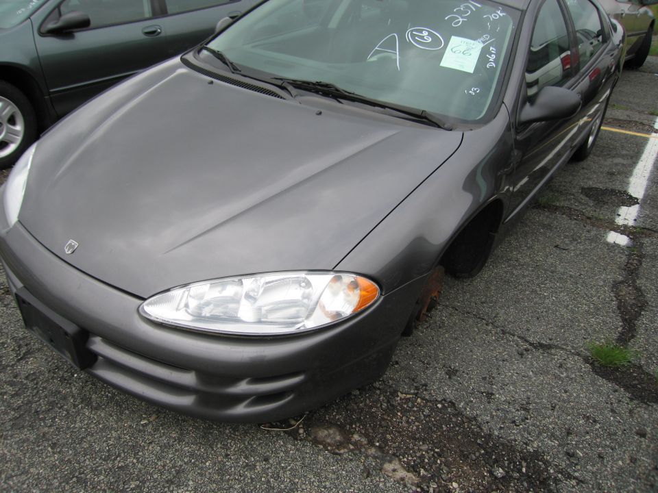 Gray Dodge Intrepid parked, front quarter view, missing front passenger wheel