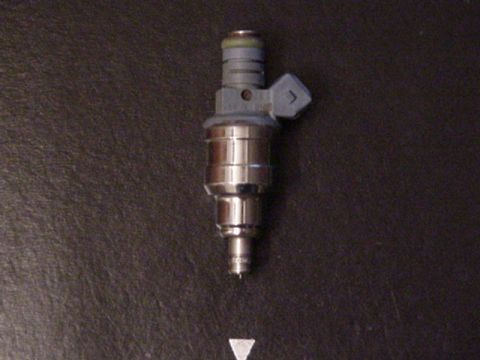 1979 Ford Bronco - Close-up of a single fuel injector, likely for an EFI system.