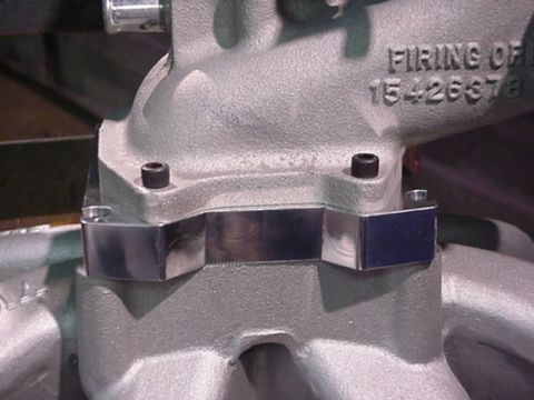 1979 Ford Bronco - Close-up view of an engine intake manifold with part numbers and firing order information cast into the metal.