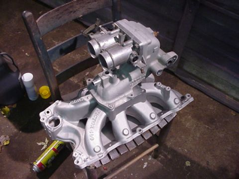 1979 Ford Bronco - Silver intake manifold and throttle body assembly, possibly for a V8 engine, with 'VICTOR 400' cast into the manifold.
