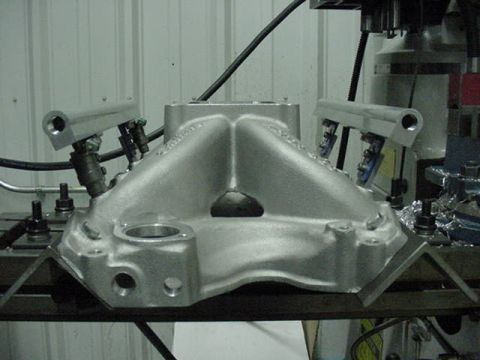 1979 Ford Bronco - An aluminum intake manifold with fuel injectors is shown, likely for a custom engine build.