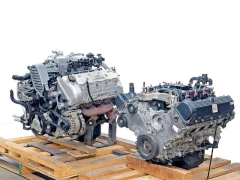 2007 Ford Mustang - Photo of two physical engine assemblies, not a technical document.