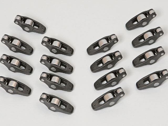 Photo of a set of roller rocker arms on a white surface