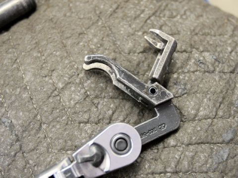 2007 Ford Mustang - Photo of a physical small metal part, not a technical document.