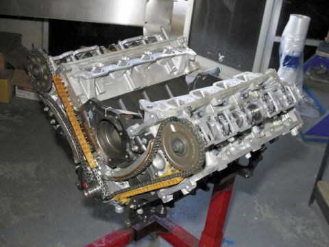2007 Ford Mustang - Photo of a physical engine block being assembled, not a technical document.