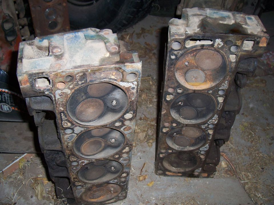Two cylinder heads showing combustion chambers and valves