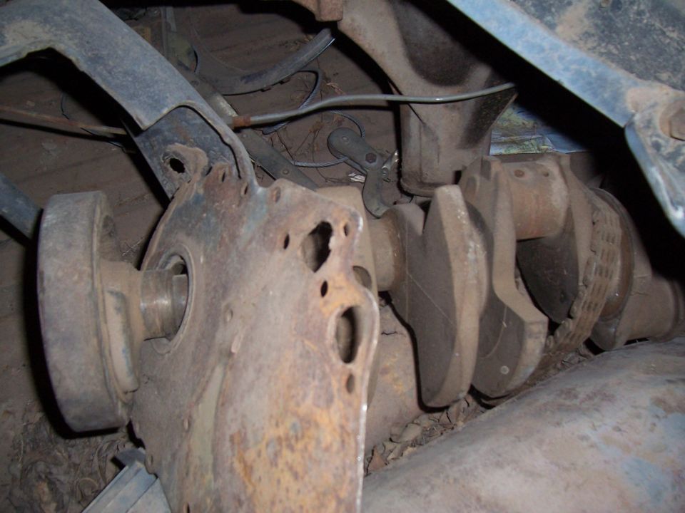 Front suspension and brake components under a vehicle