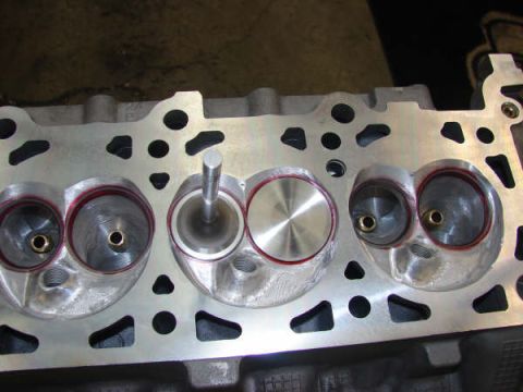 2007 Ford Mustang - Photo of a physical cylinder head with valve, not a technical document.