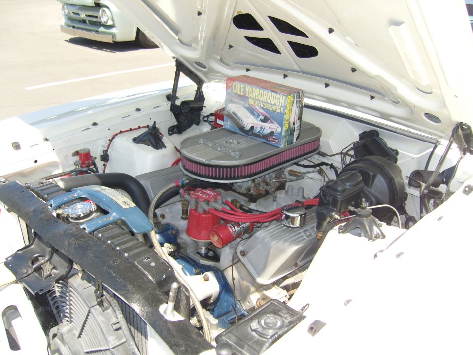 Classic Ford engine bay with chrome air cleaner and a Cale Yarborough model box