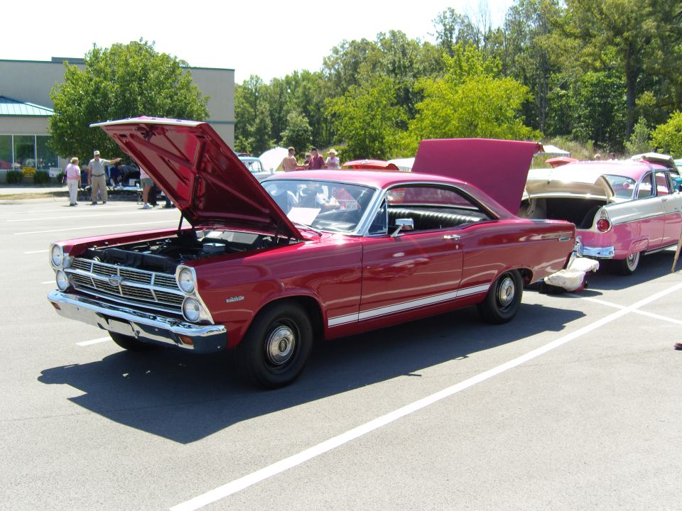 Red 1967 Ford Fairlane two-door hardtop at a car show