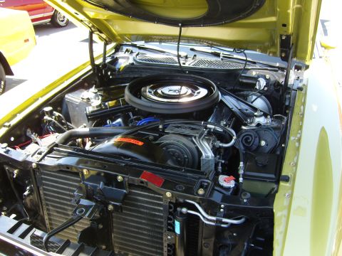 2007 Ford Mustang - Close-up of a car's engine bay, with another vehicle visible in the background.
