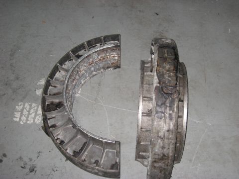 1991 Ford Bronco - A damaged turbine housing, separated into two sections, reveals its internal components and signs of significant wear and tear.