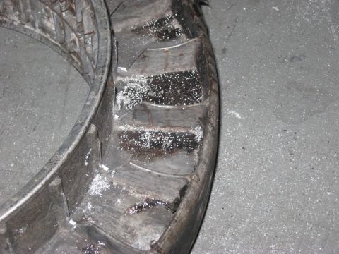1991 Ford Bronco - Close-up of a damaged wheel rim and tire, possibly from off-road use.