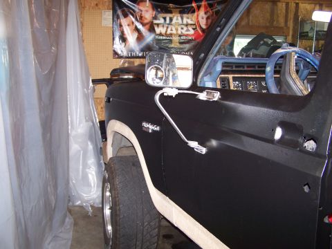 1986 Ford Bronco - Side view of a 1986 Ford Bronco, possibly undergoing restoration or painting.