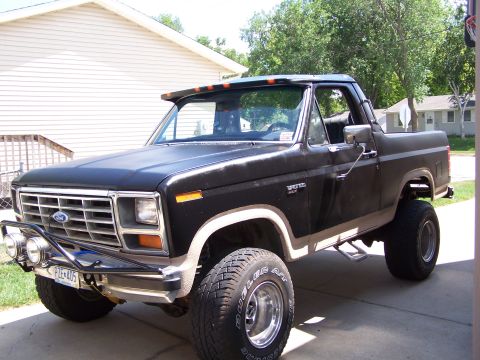 1986 Ford Bronco - This 1986 Ford Bronco is parked outside a house, showing its front 3/4 view.