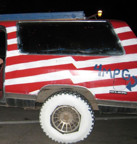2004 Ford F-150 - This SUV features a patriotic paint scheme and a humorous "4 MPG" decal, along with a politically charged bumper sticker.