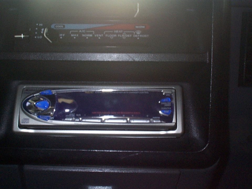 Car interior with aftermarket stereo and climate controls